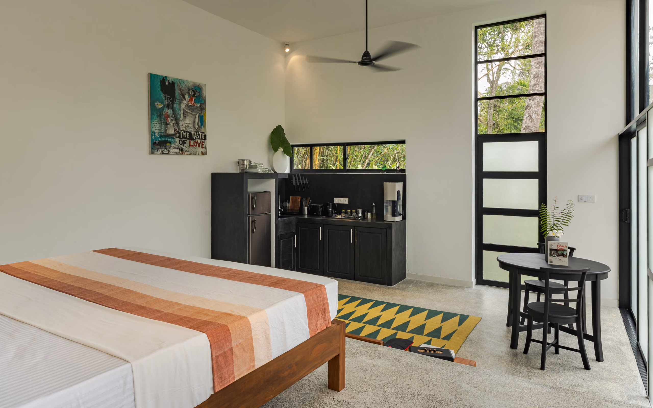 Bedroom interior with kitchenette of the Pool Bungalow at Licuala Lanka, Ahangama, Sri Lanka