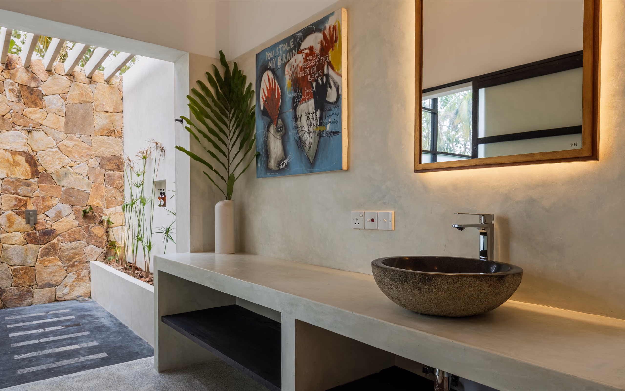 Bathroom vanity facing the stone court in the Pool Bungalow, Licuala Lanka near Kabalana Beach, Sri Lanka