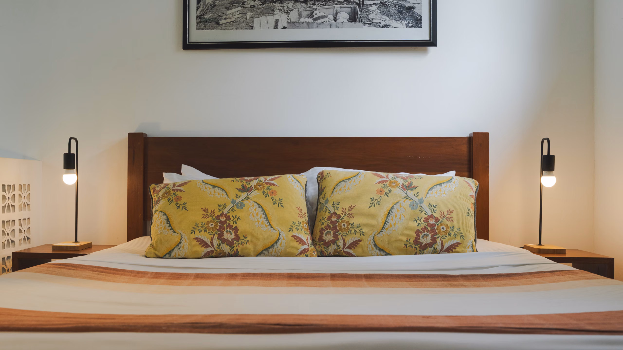 Queen bed with reading lamps in the Tropical House at Licuala Lanka, Ahangama, Sri Lanka