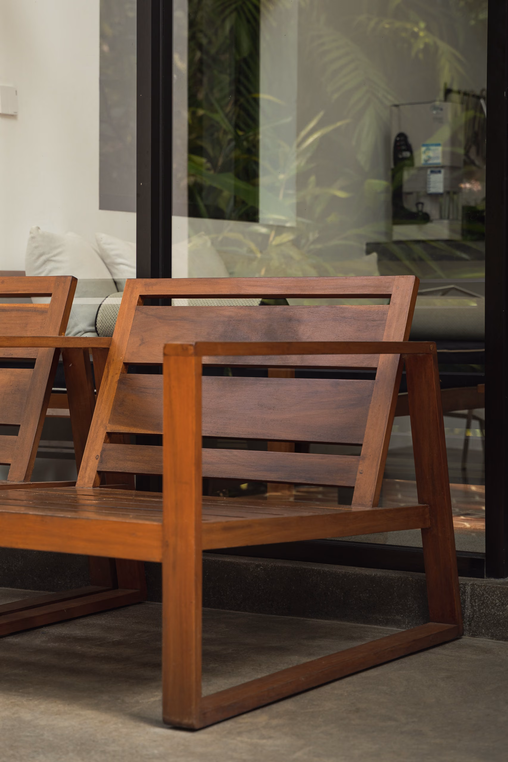 Wooden armchairs on the Tropical House patio at Licuala Lanka, Ahangama, Sri Lanka