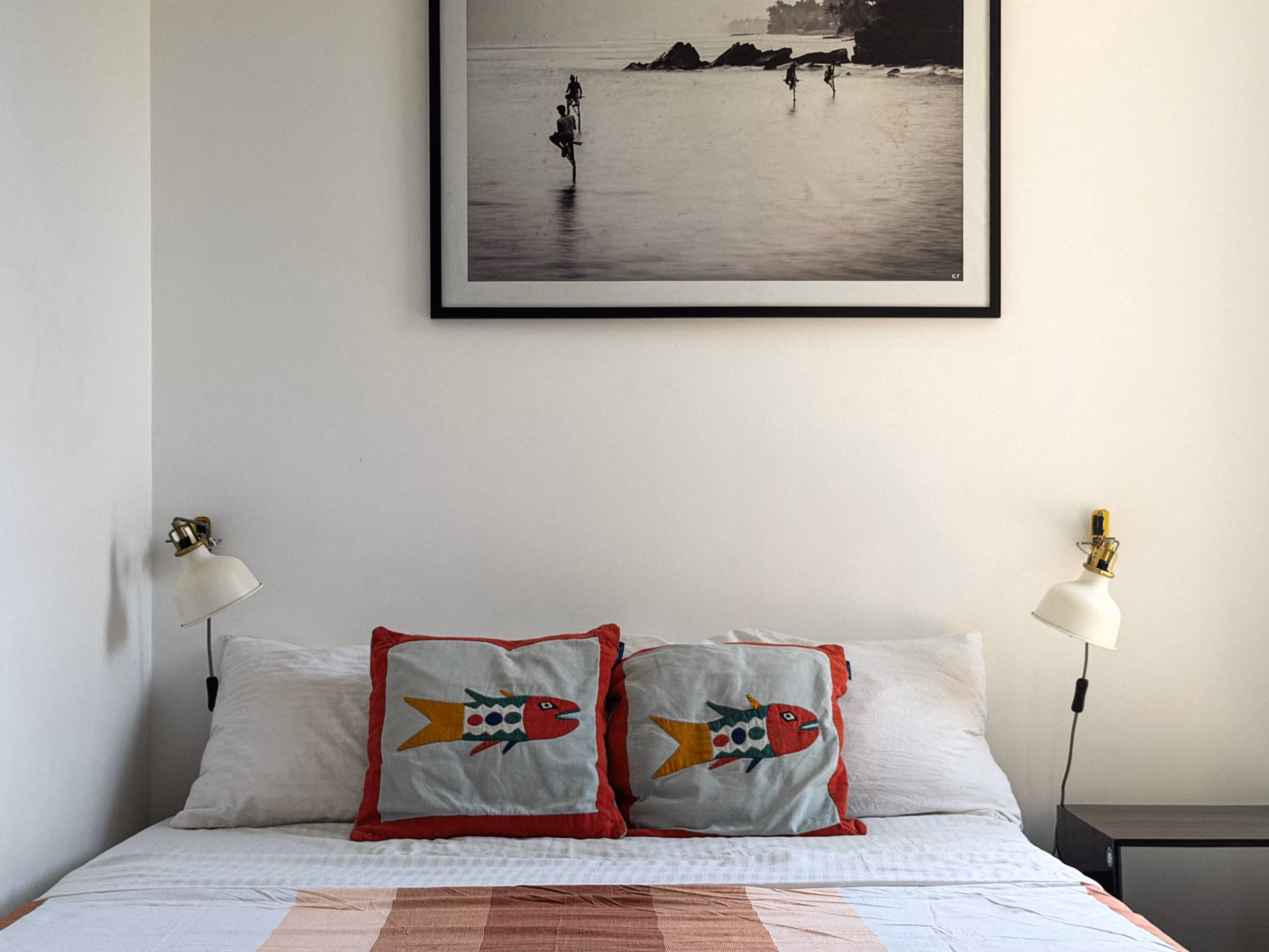 Bedroom with fish cushions and surf art in the Jungle Home, Licuala Lanka on Sri Lanka's South Coast