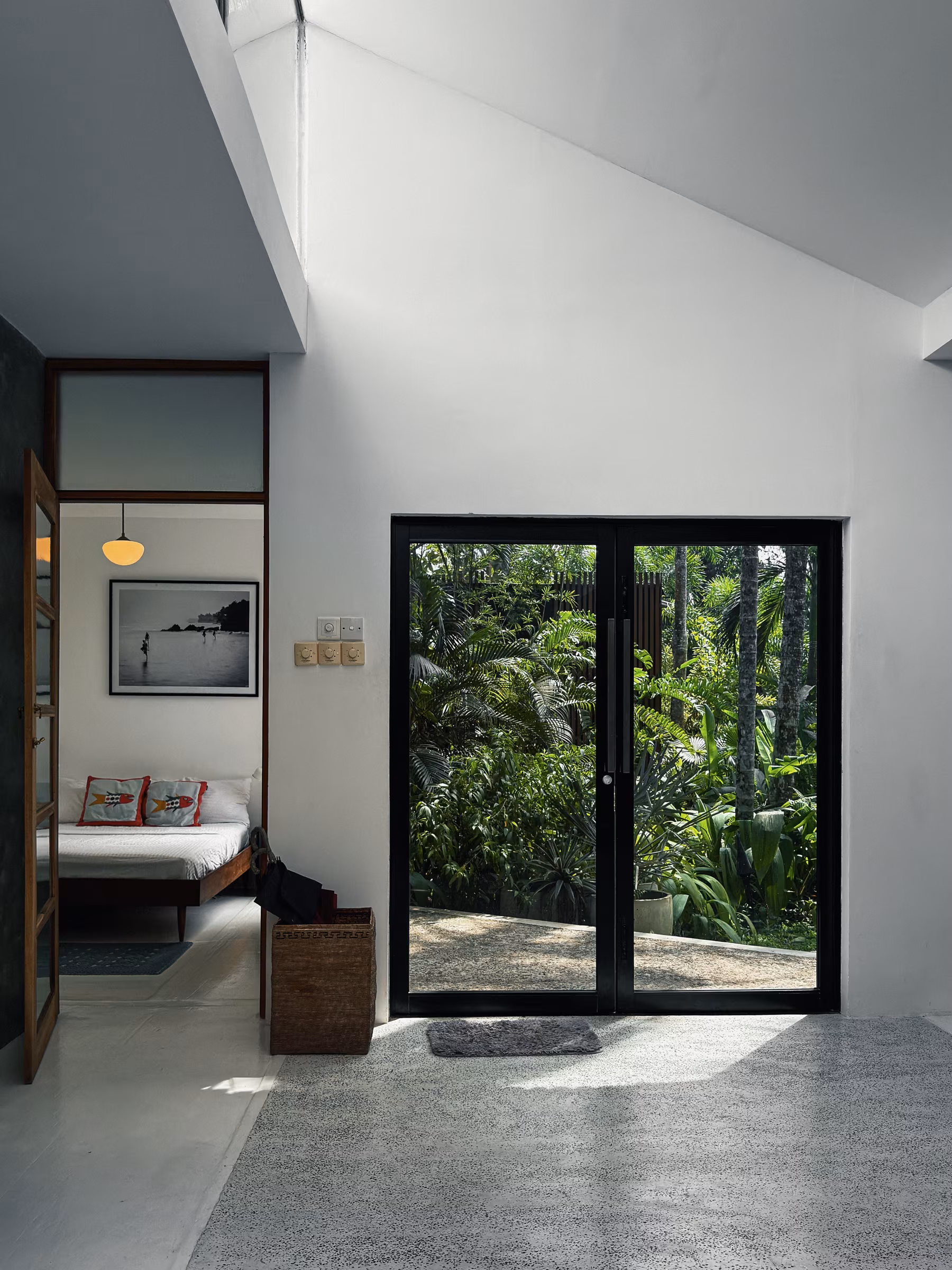 Hallway with glass door to the jungle in the Jungle Home, Licuala Lanka on Sri Lanka's South Coast