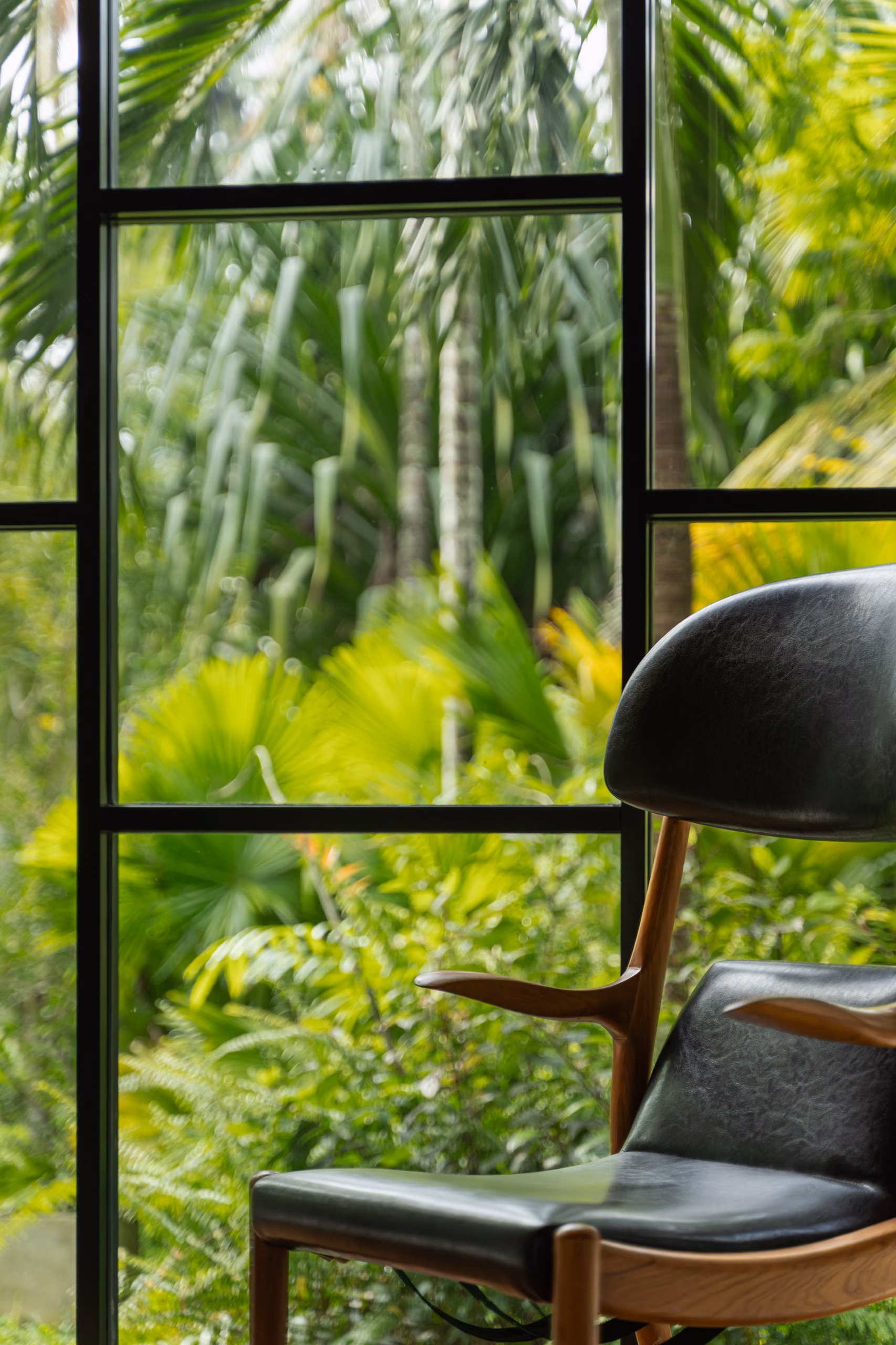 Reading chair by the jungle window in the Jungle Bungalow at Licuala Lanka on Sri Lanka's South Coast