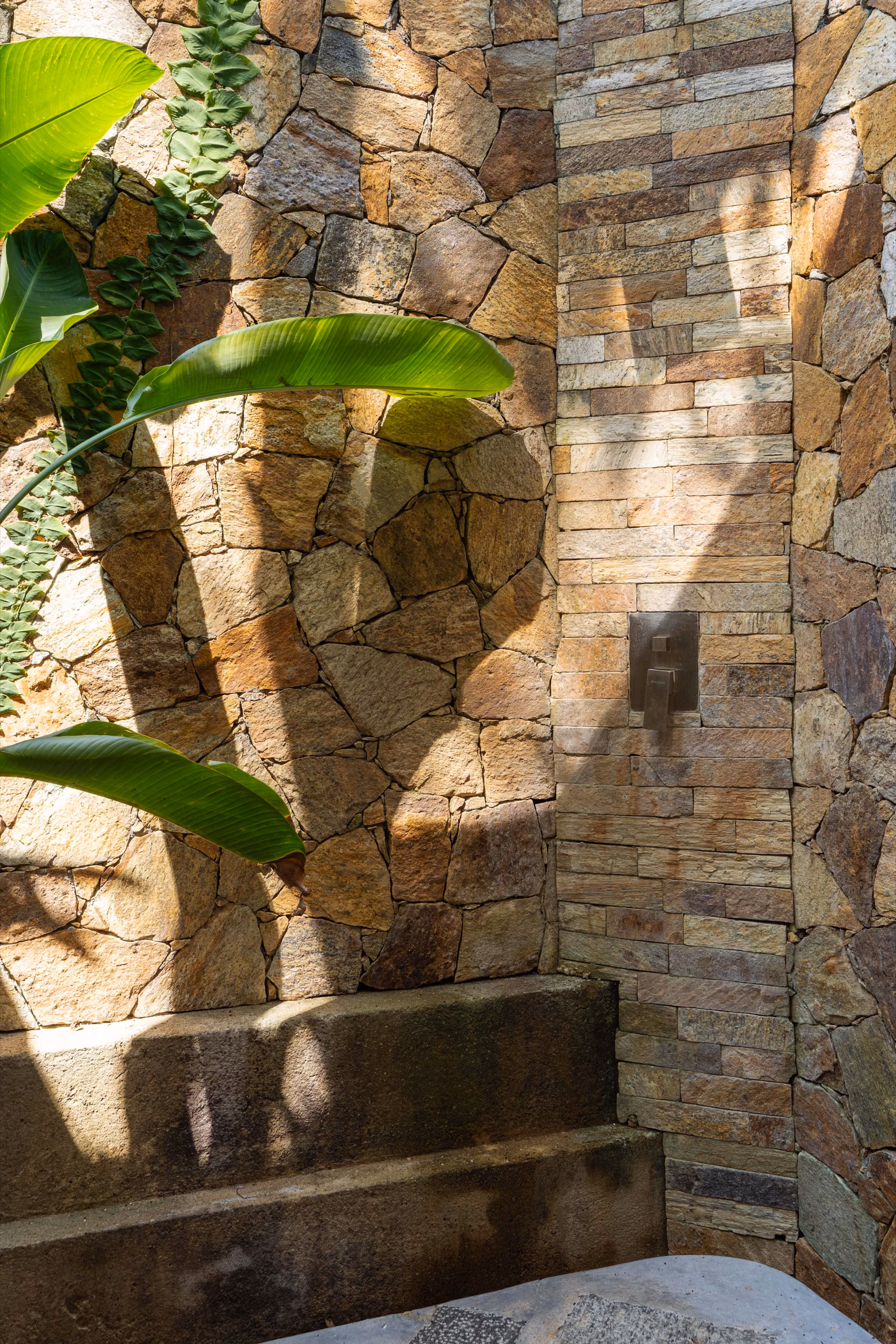 Outdoor stone shower of the Jungle Bungalow at Licuala Lanka, Ahangama, Sri Lanka