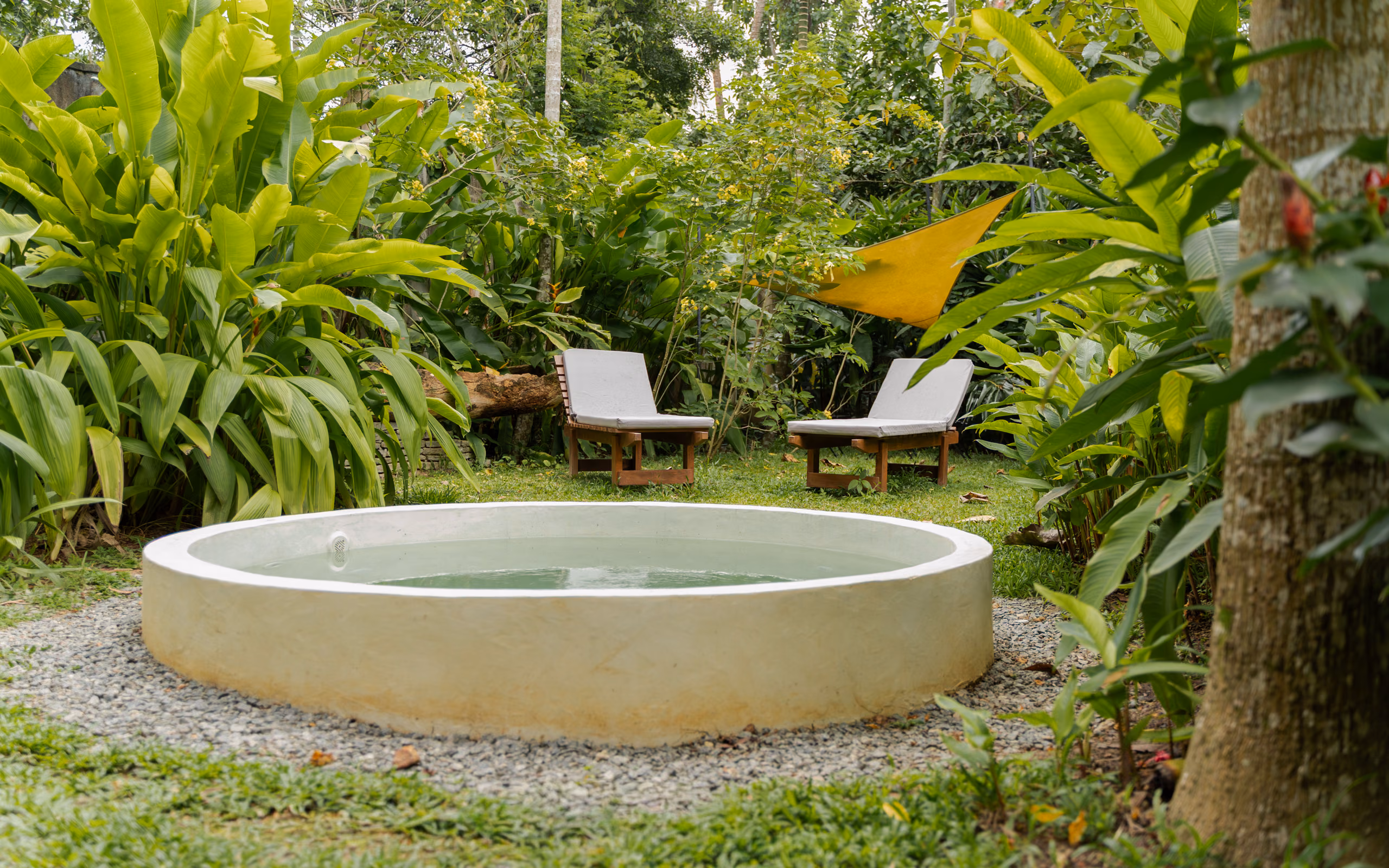 Round plunge pool and loungers in the Jungle Bungalow garden, Licuala Lanka, Ahangama, Sri Lanka