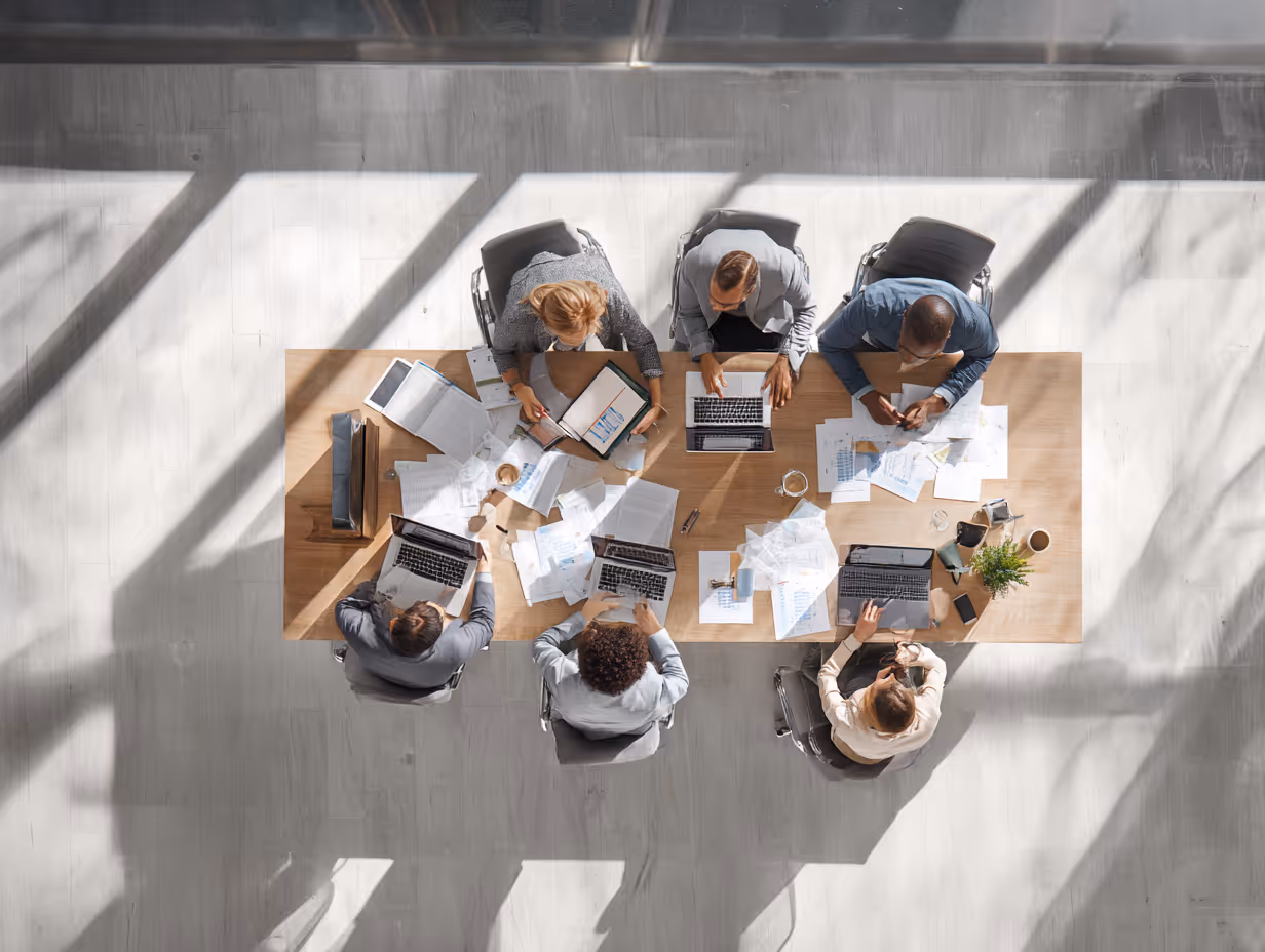 Team analyzing compliance reports in office