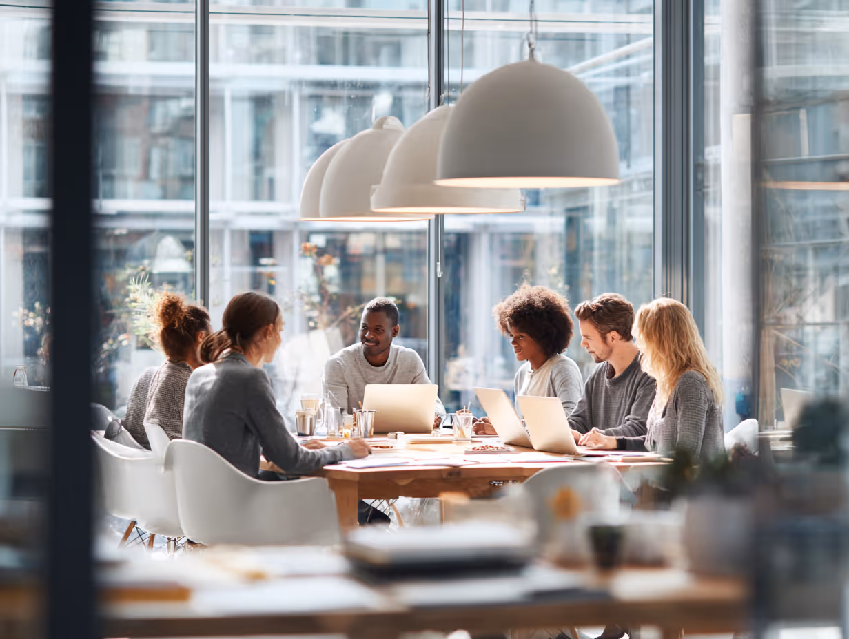 Team analyzing compliance reports in office