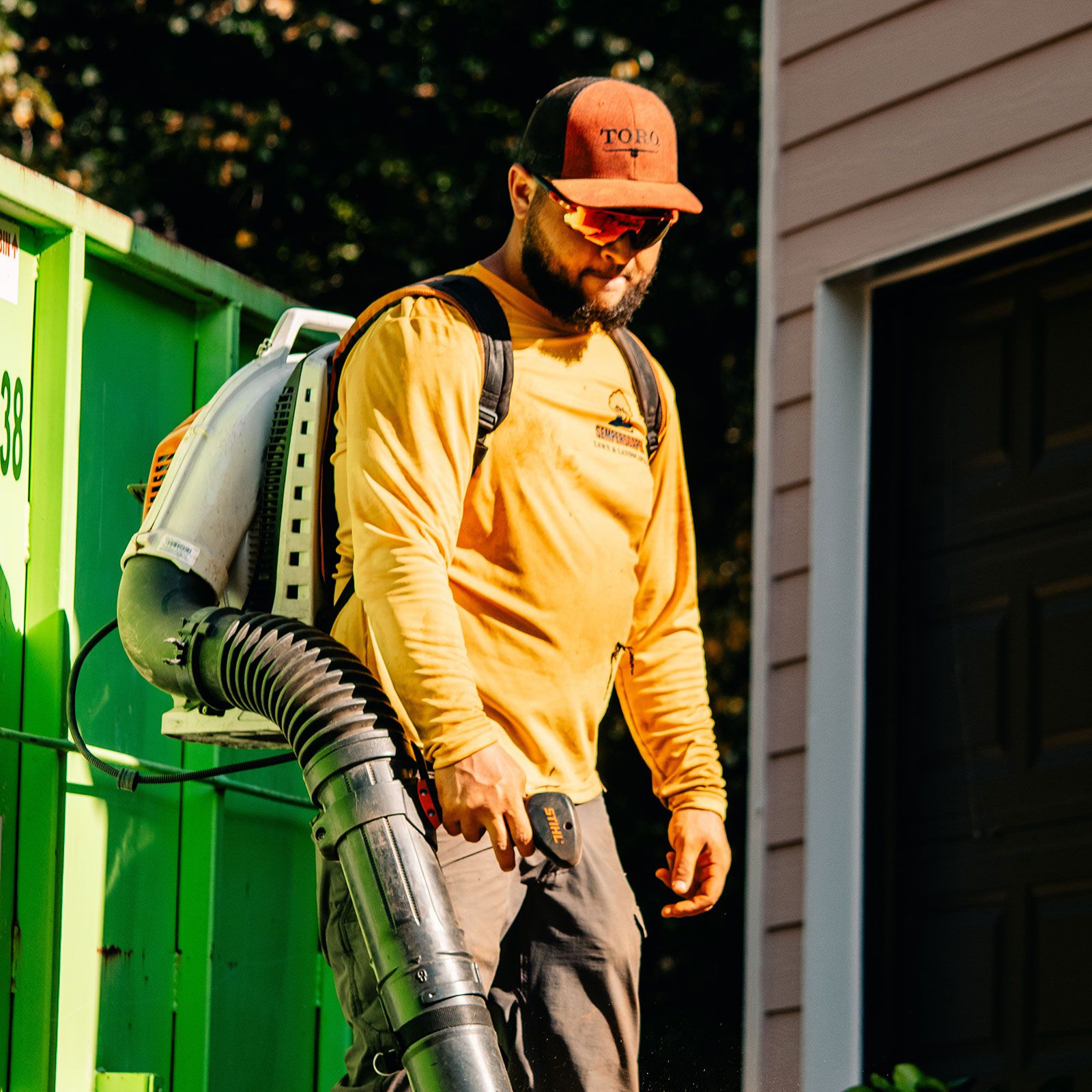 SemperScapes Crew Member leaf blowing in Cherokee, GA 