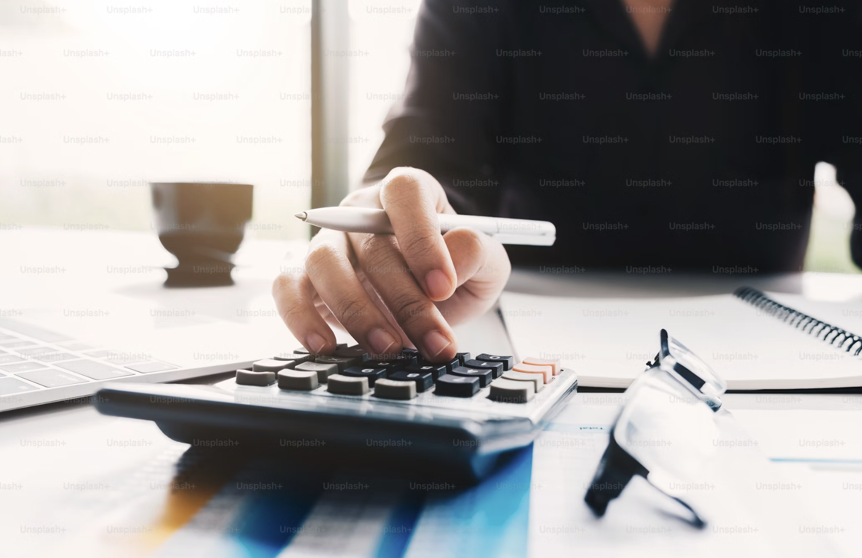 Person using calculator 