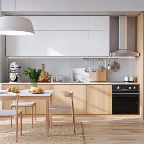 Minimalist kitchen with light wood cabinetry and built-in oven
