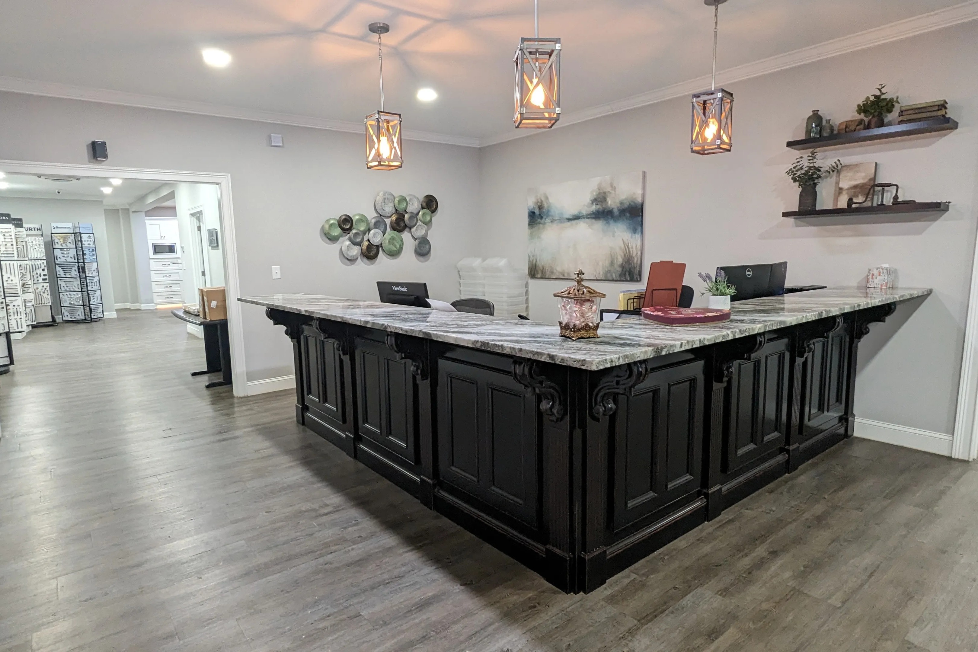Black double island kitchen with custom pendant lighting