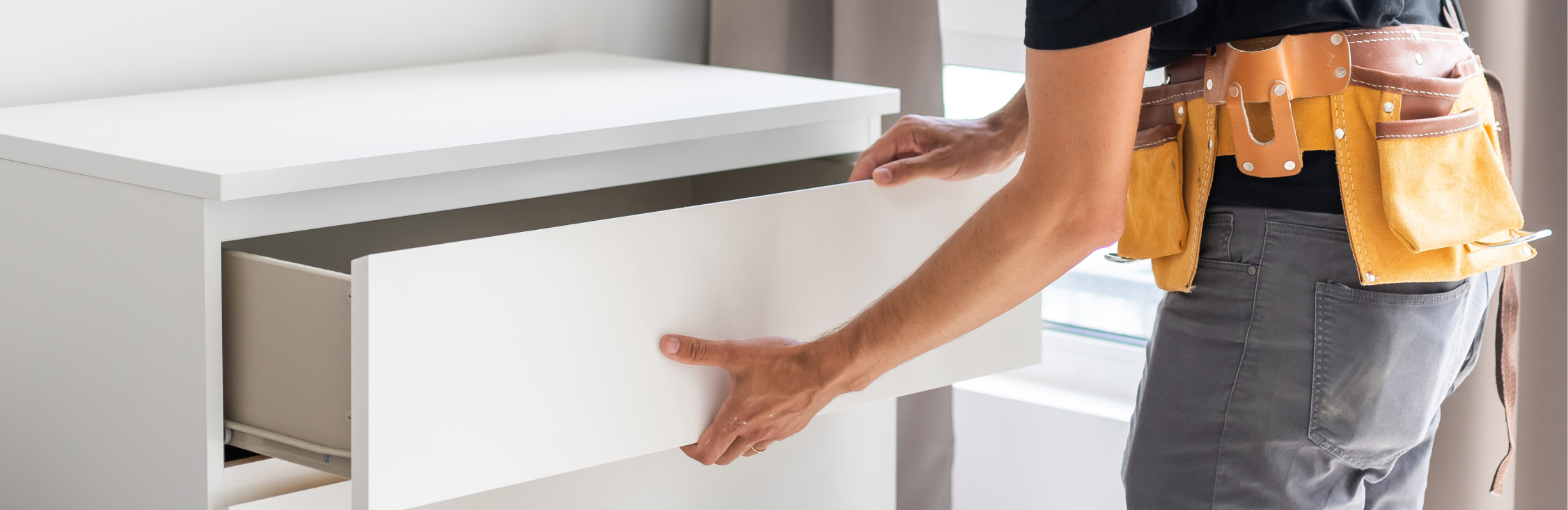 Client and designer reviewing cabinet samples and floor plans