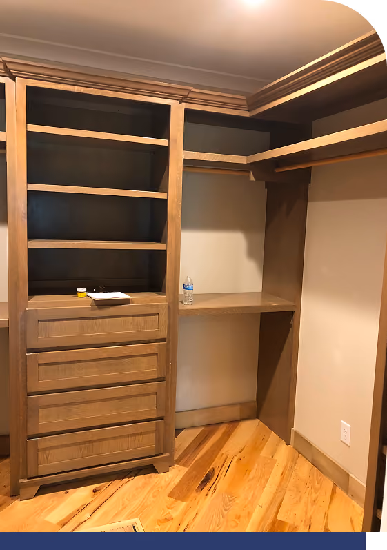Custom closet built-ins with wood drawers and hanging space