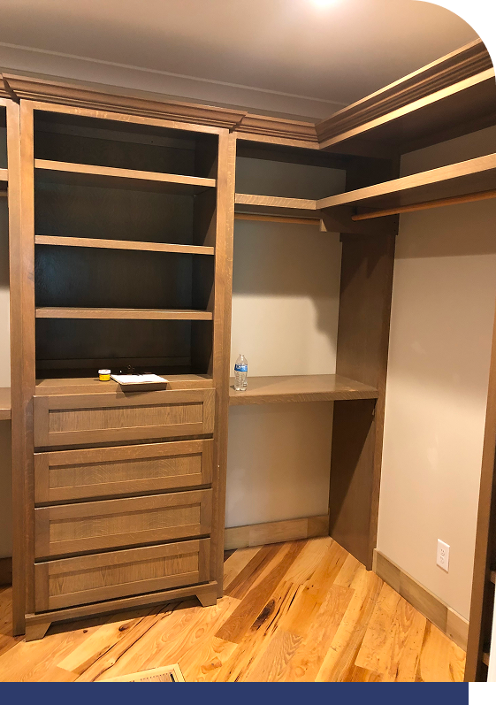Custom closet built-ins with wood drawers and hanging space