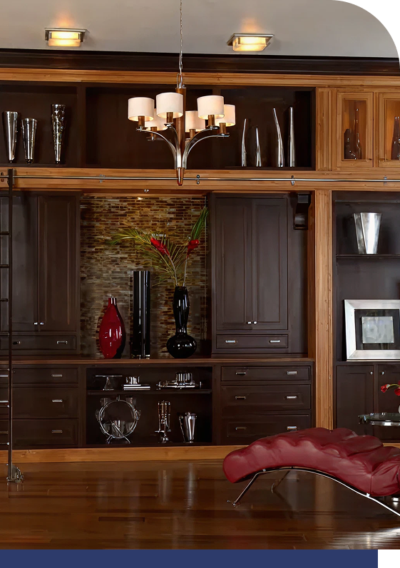 Traditional office built-ins with dark wood cabinetry and red accents