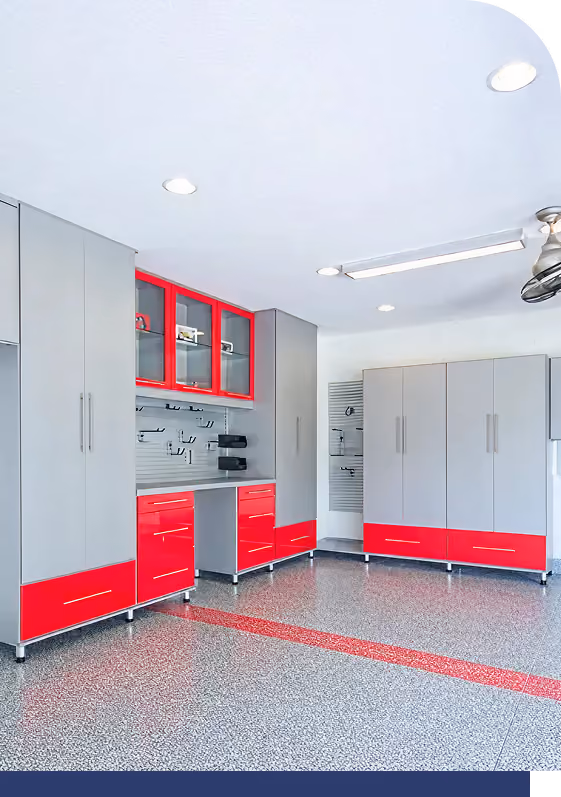 Bold red garage cabinetry with lower drawers and wall cabinets