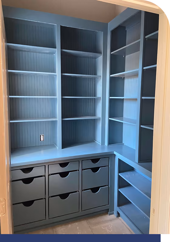 L-shaped blue pantry cabinet with drawer units