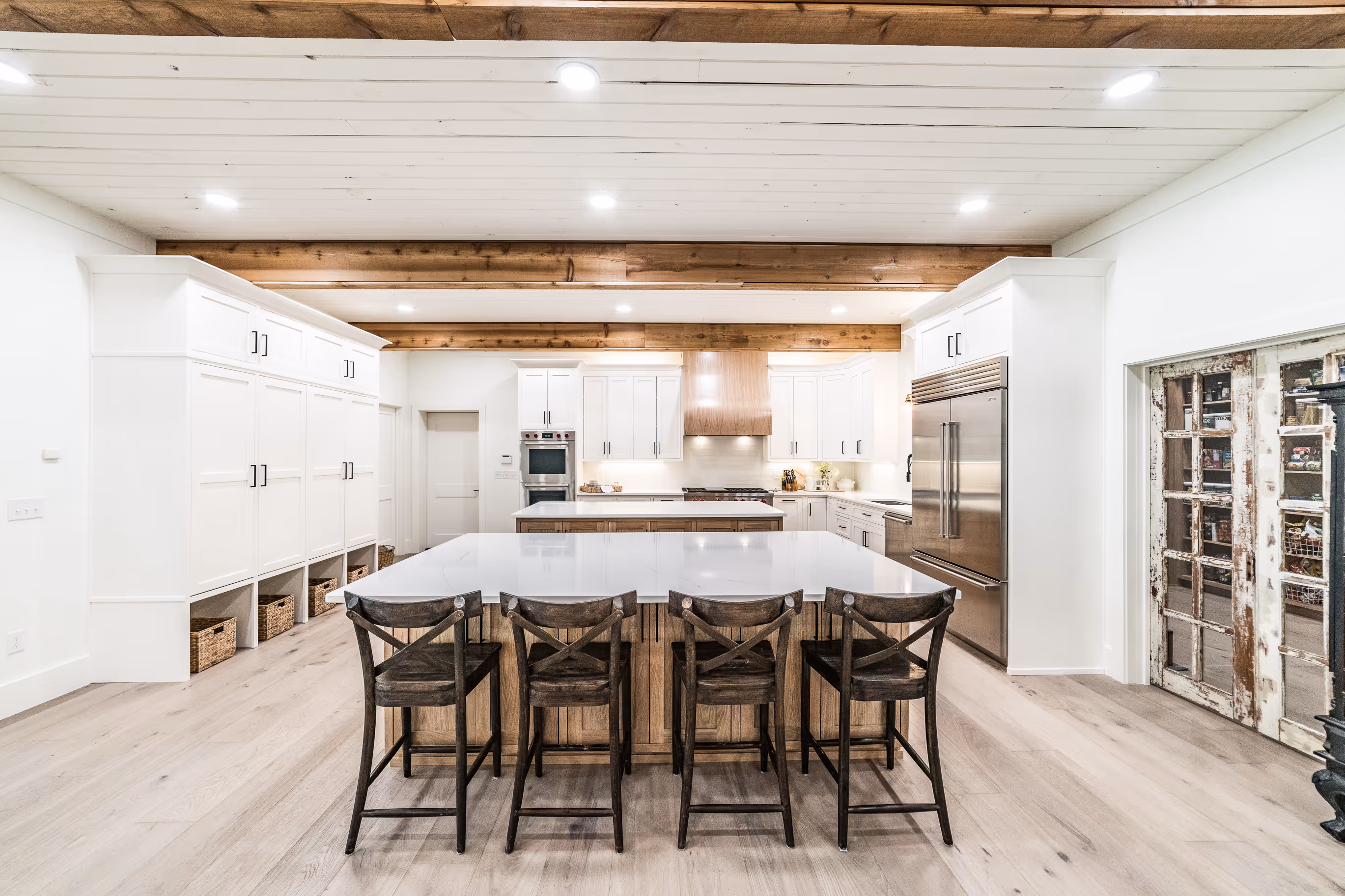 Formal dining area with adjacent custom cabinetry and lighting
