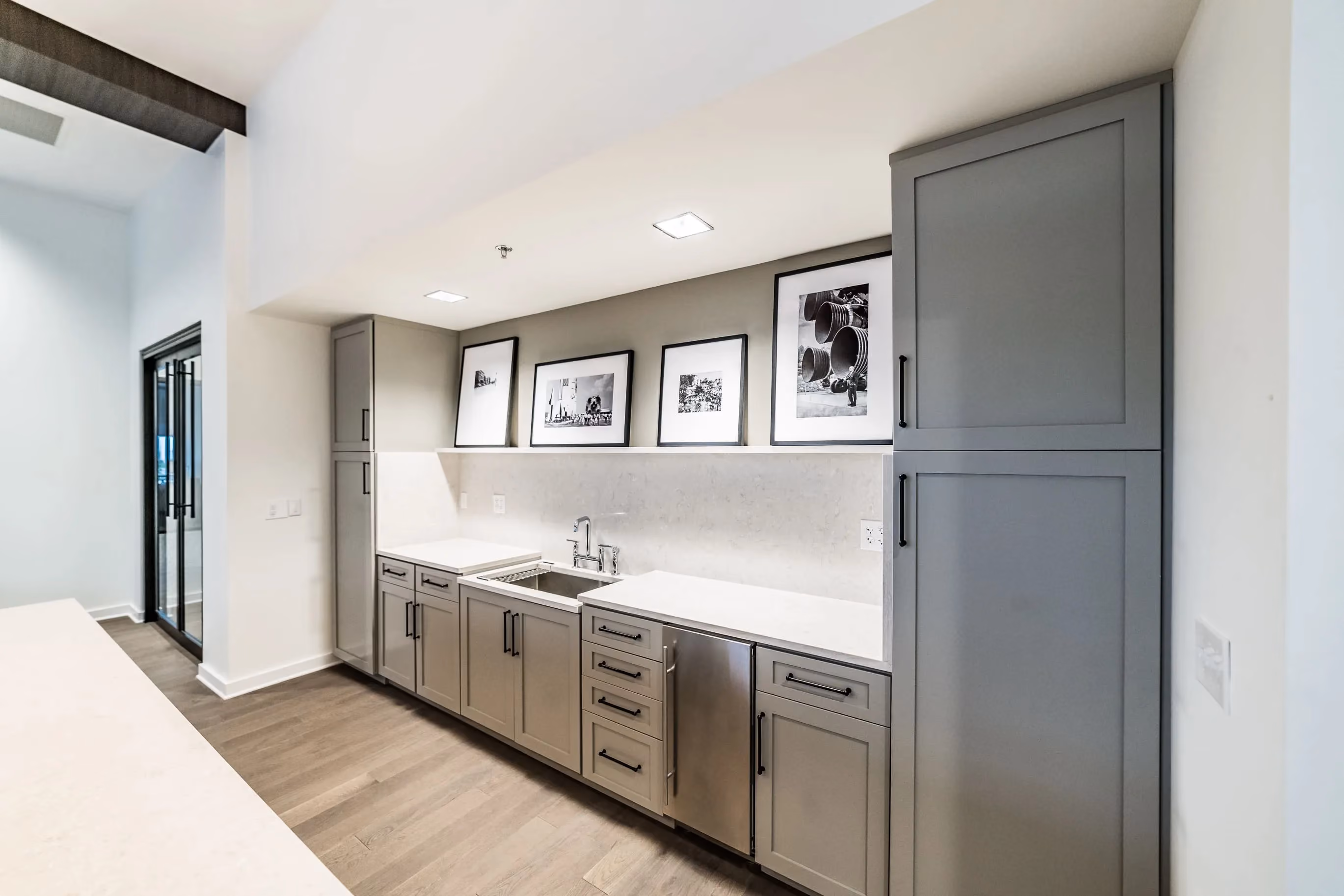 Galley-style kitchen with custom cabinets and under-cabinet lighting