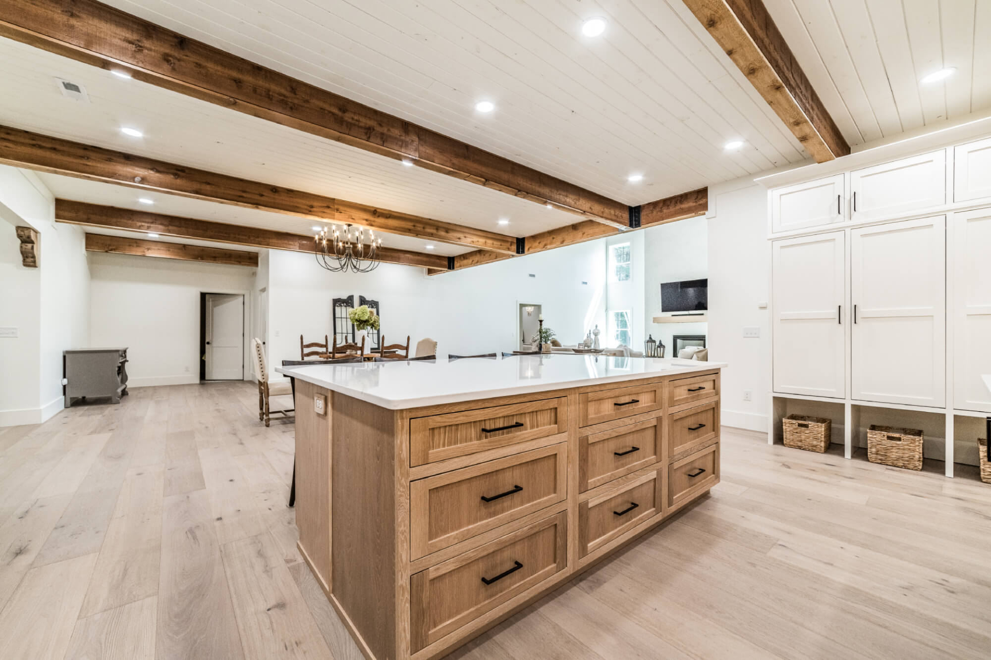 Spacious kitchen with island and natural wood cabinetry