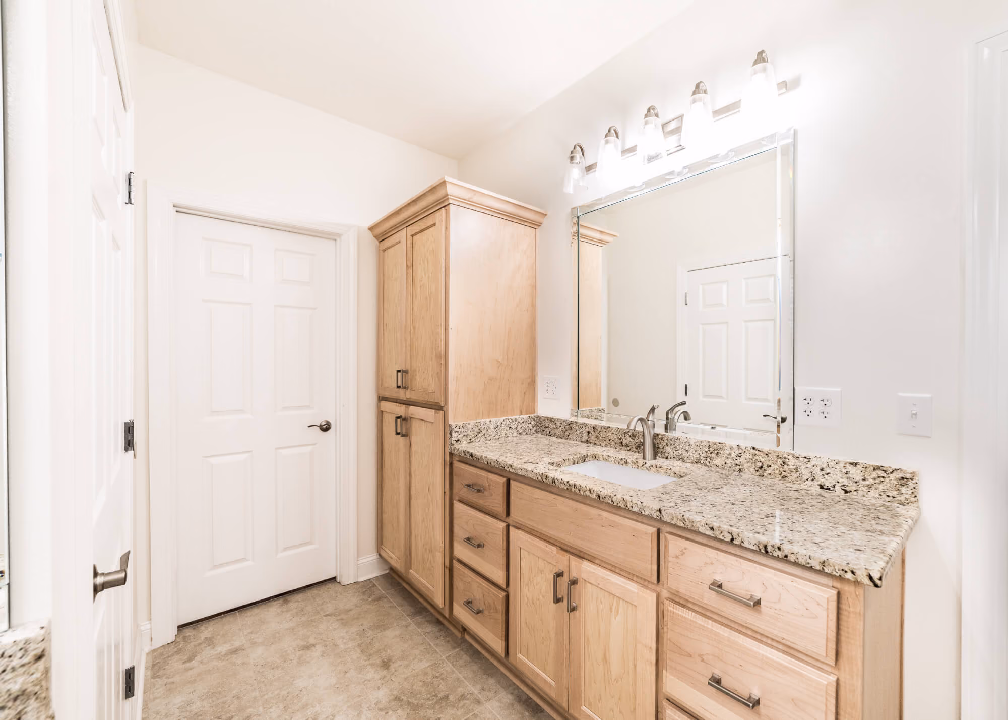 Corner vanity with shaker-style bathroom cabinetry
