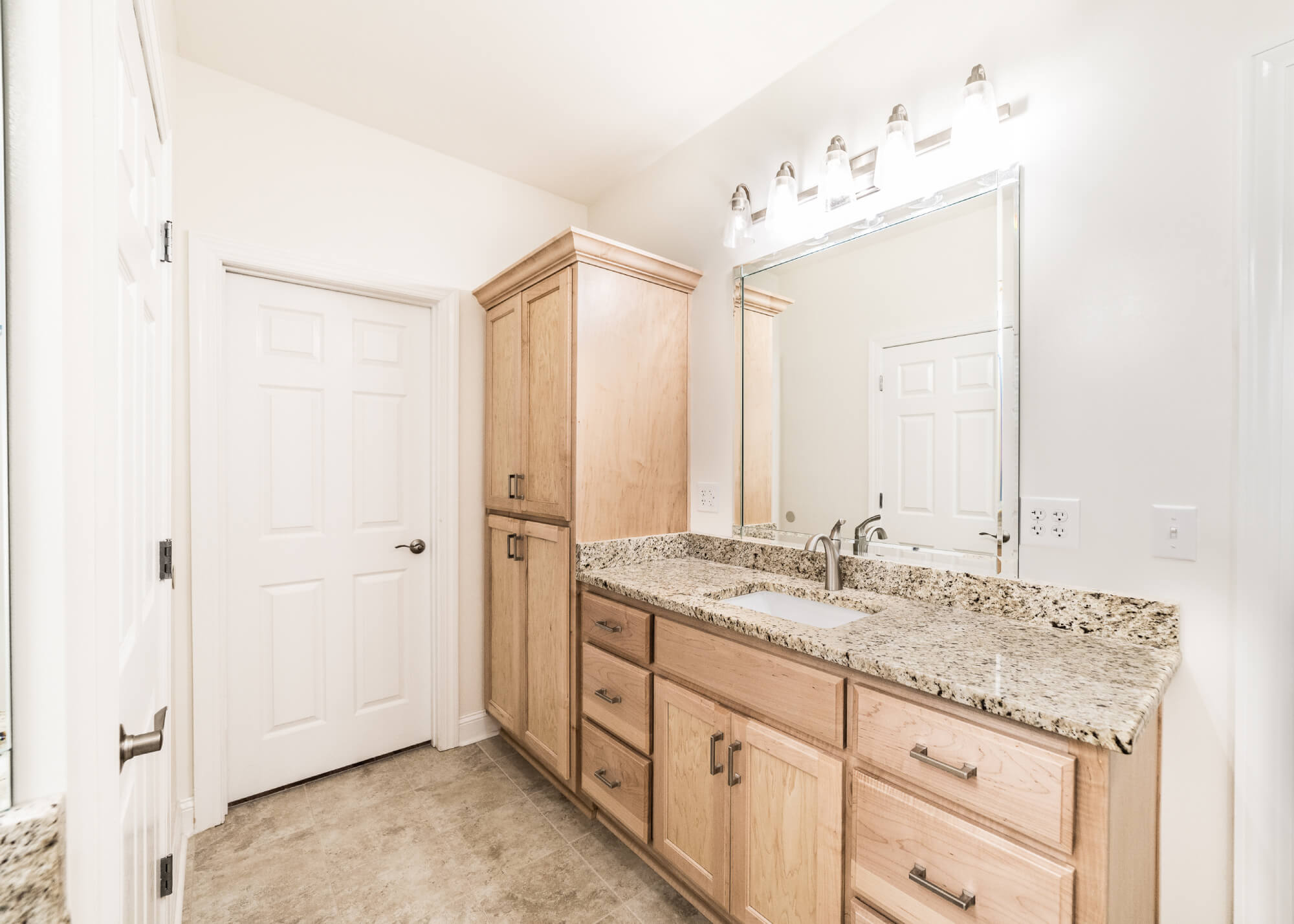 Corner vanity with shaker-style bathroom cabinetry