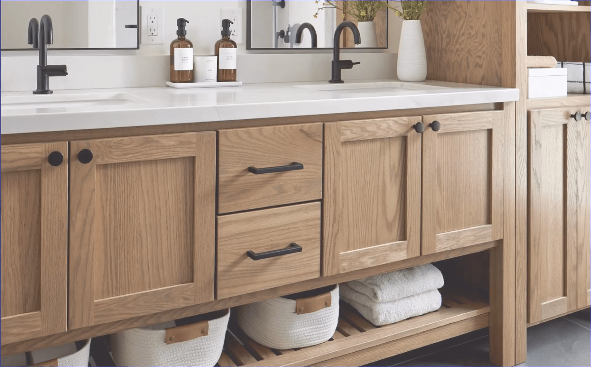 Bathroom cabinetry with multiple drawers and open shelf