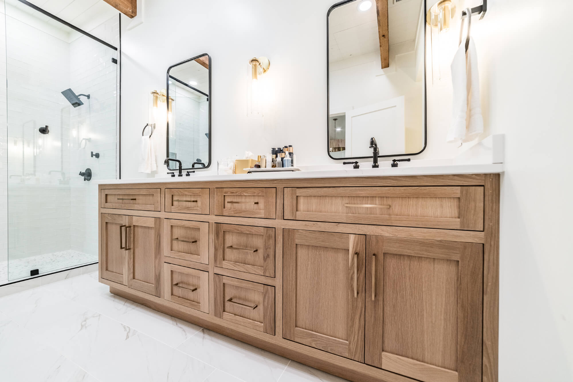 Double sink bathroom vanity with natural wood cabinets