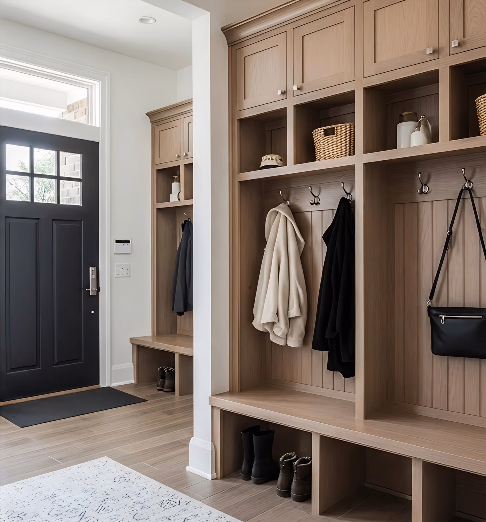 Natural wood mudroom built-ins with cubbies and seating