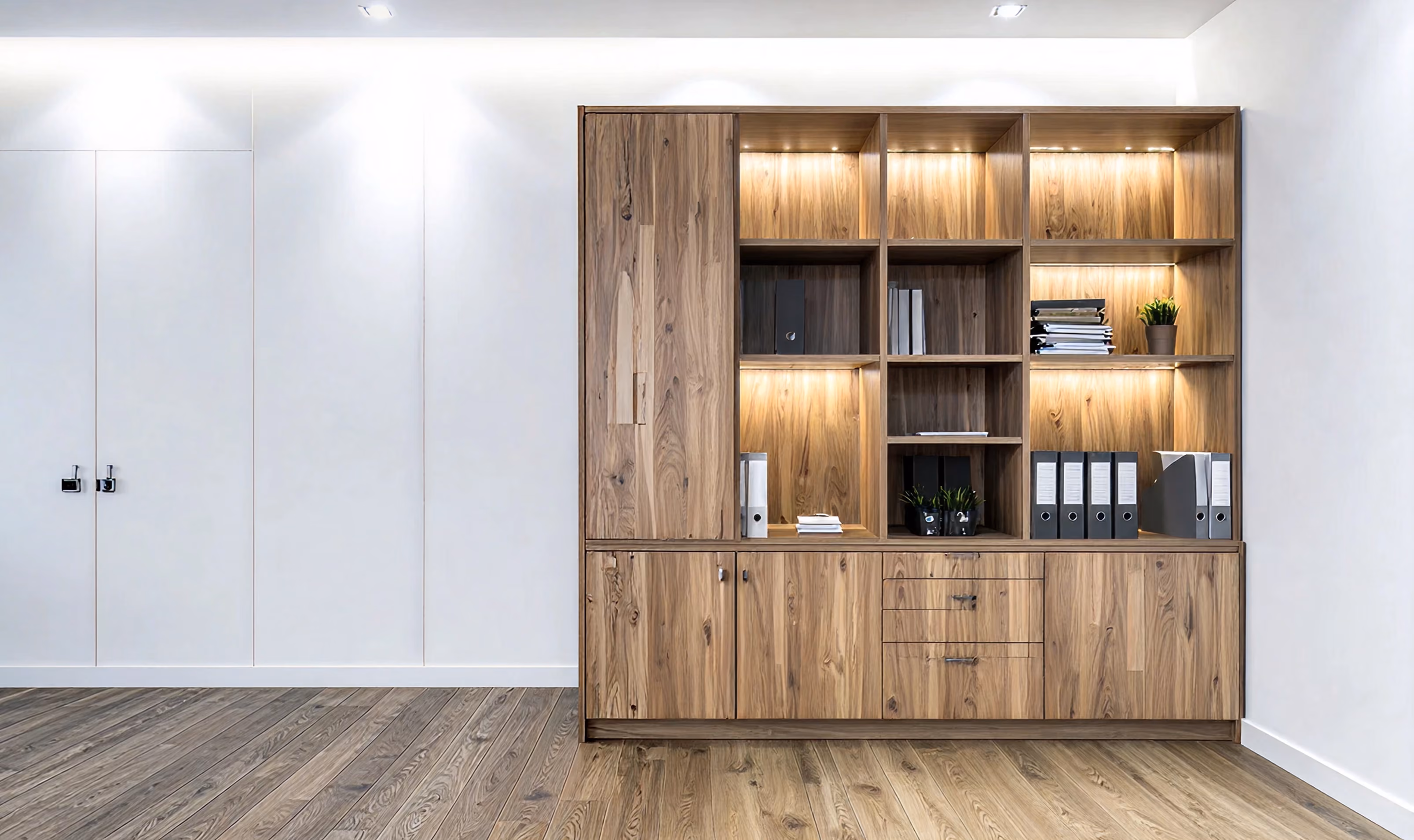Home library with custom bookshelves and cabinet drawers