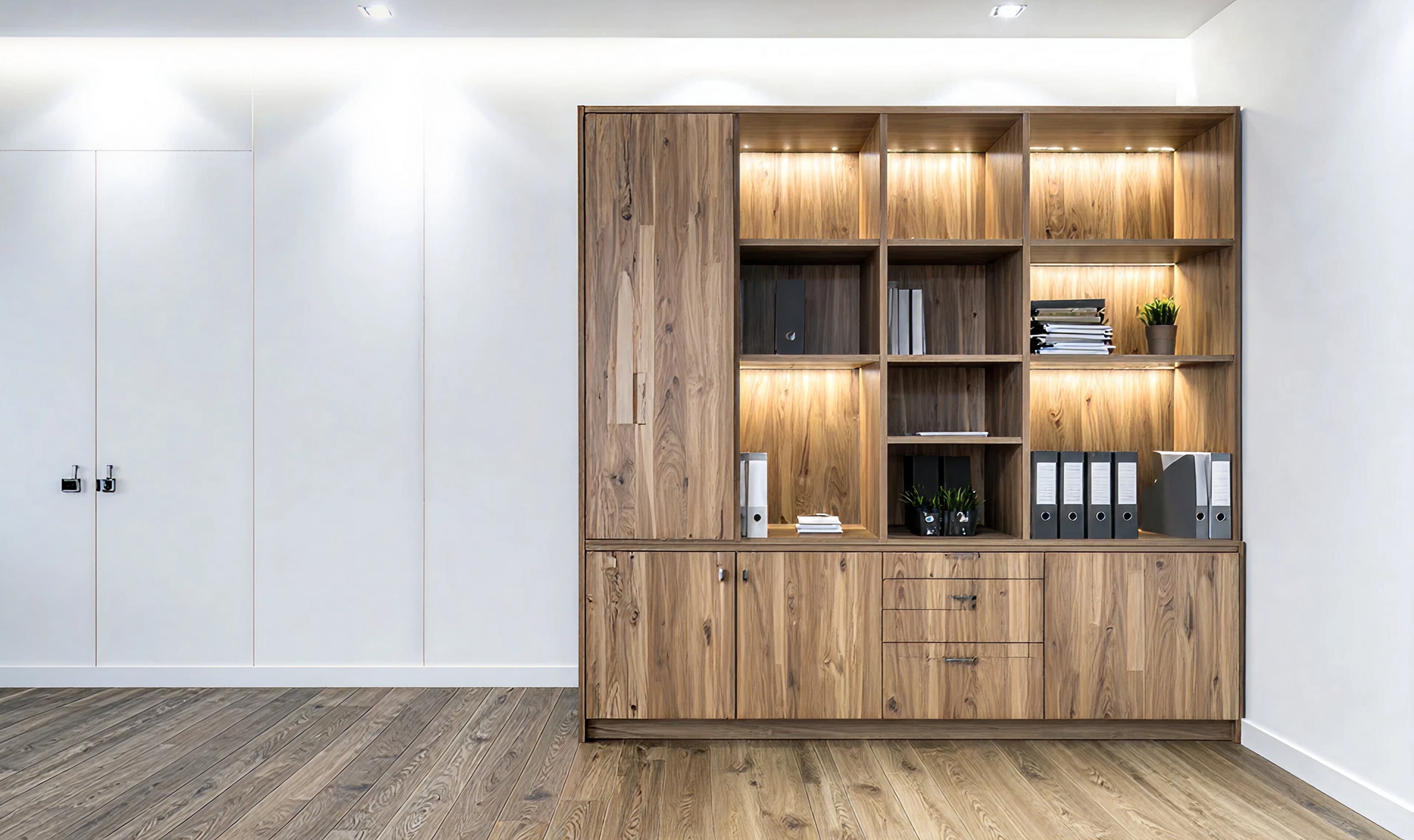 Home library with custom bookshelves and cabinet drawers