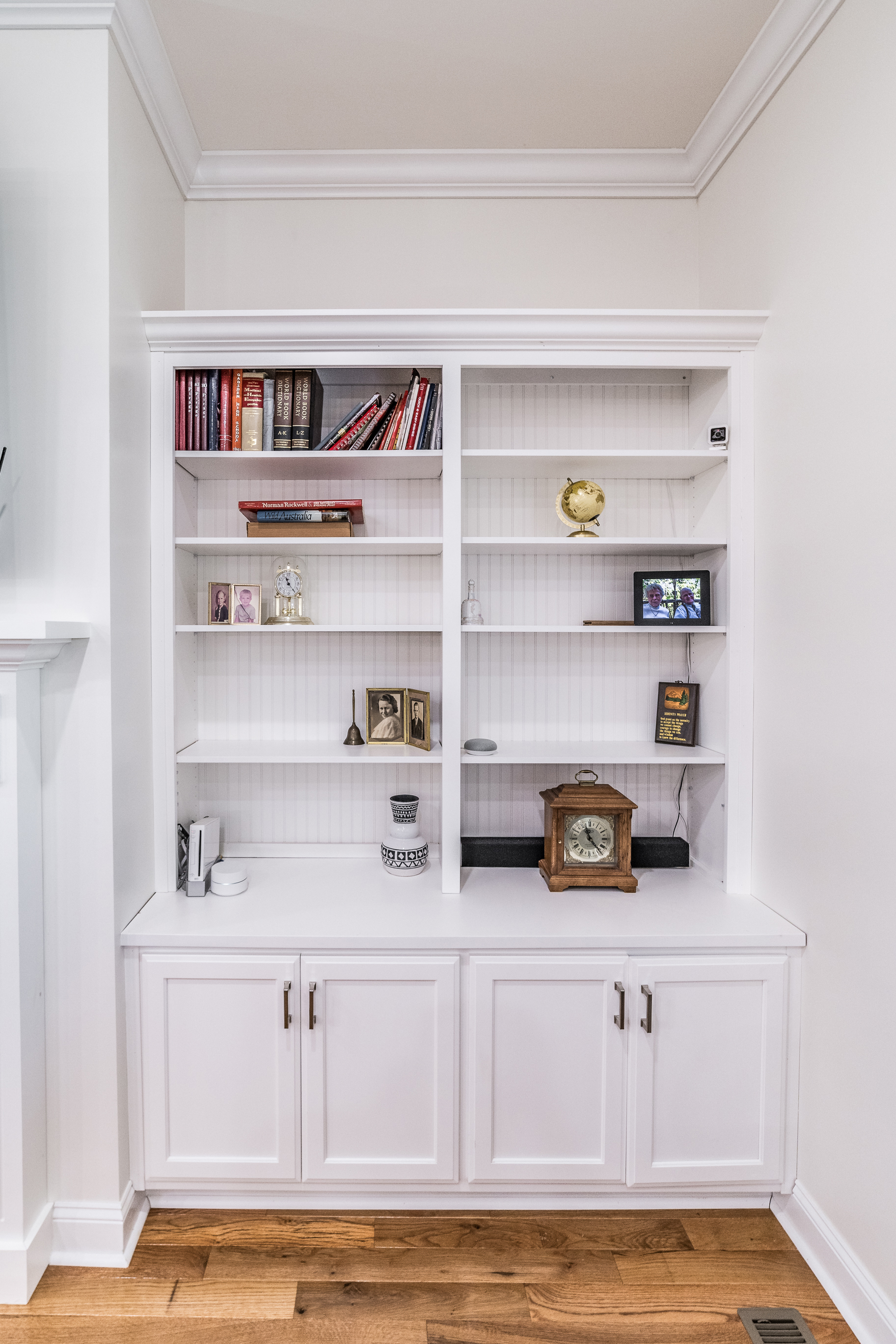 White bathroom vanity with double sinks and shaker cabinets