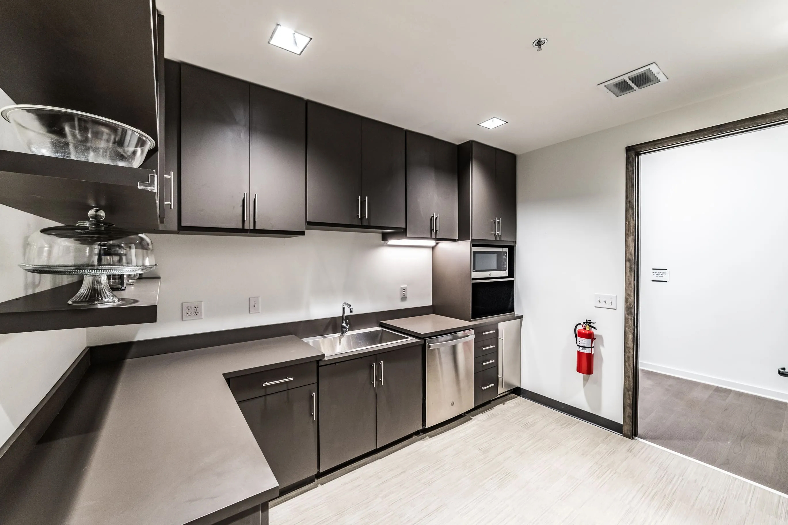 Breakroom cabinetry with upper and lower custom cabinets