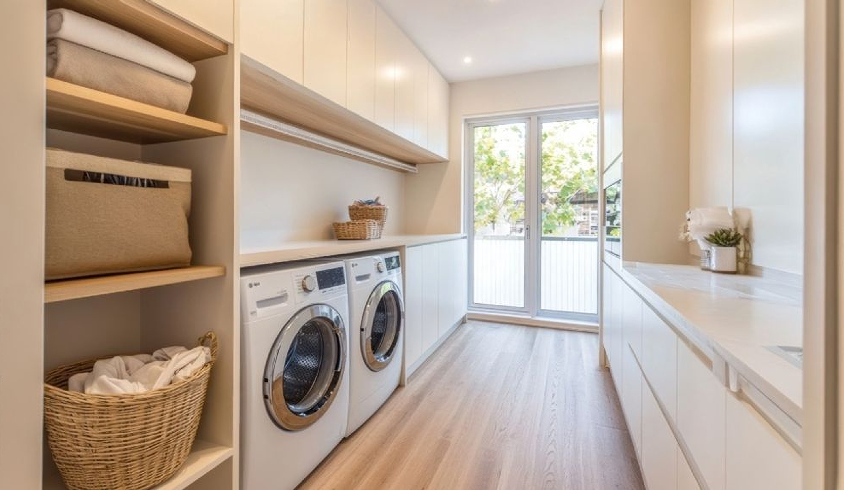 Stylish laundry storage with closed and open cabinets