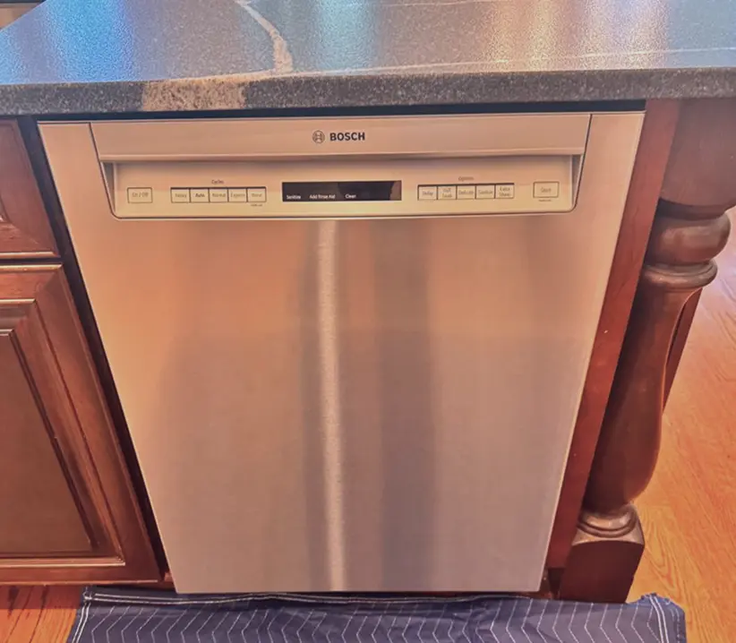 Hand holding a Mercedes car key inside vehicle – Mobile car key replacement service in Columbus, OH