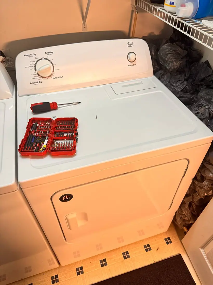 Hand holding a Mercedes car key inside vehicle – Mobile car key replacement service in Columbus, OH