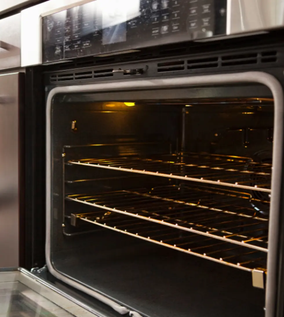 Hand holding a Mercedes car key inside vehicle – Mobile car key replacement service in Columbus, OH