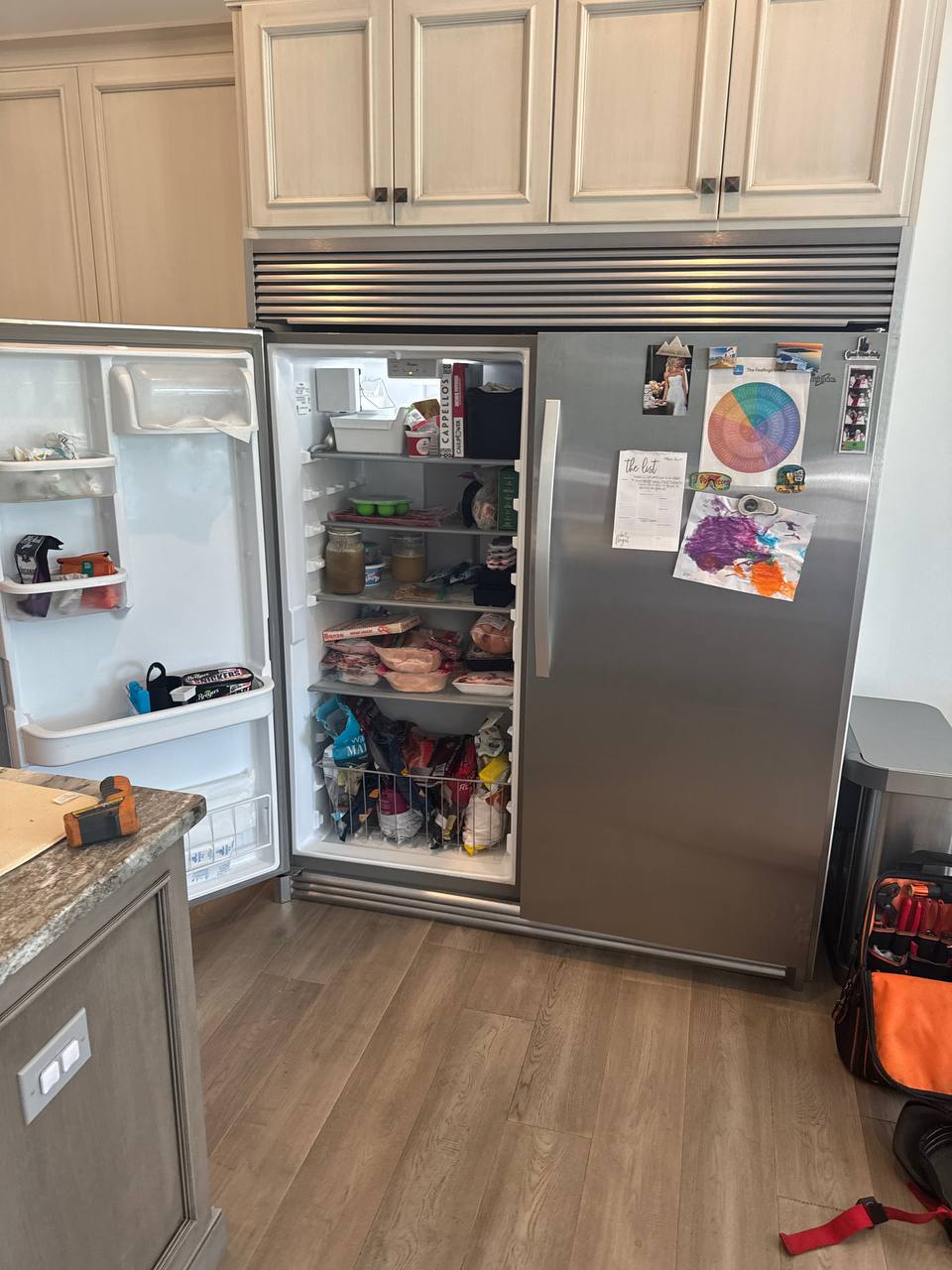 Hand holding a Mercedes car key inside vehicle – Mobile car key replacement service in Columbus, OH