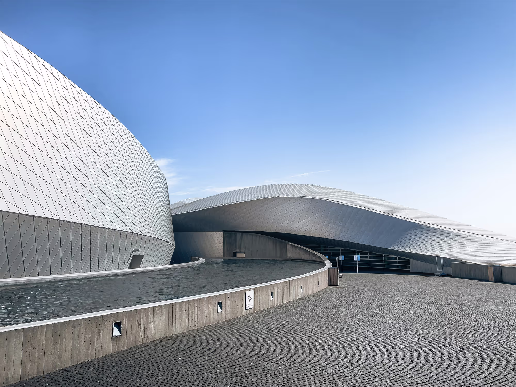 Innovative architectural structure with bold curves and contrasting materials