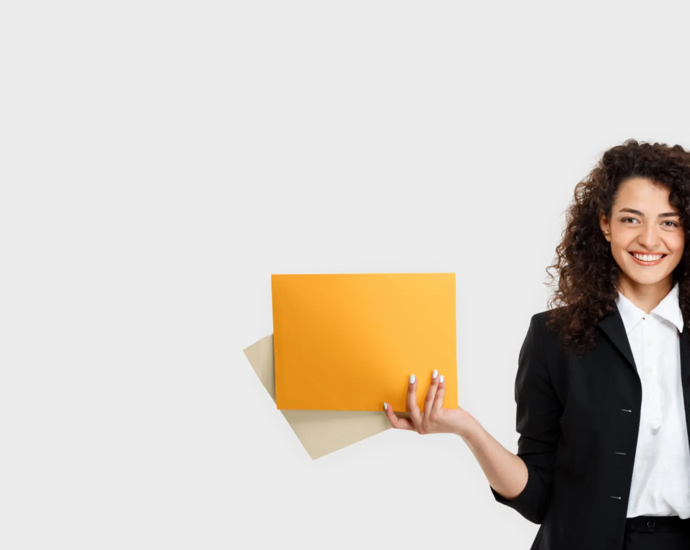 A woman holding a yellow piece of paper.