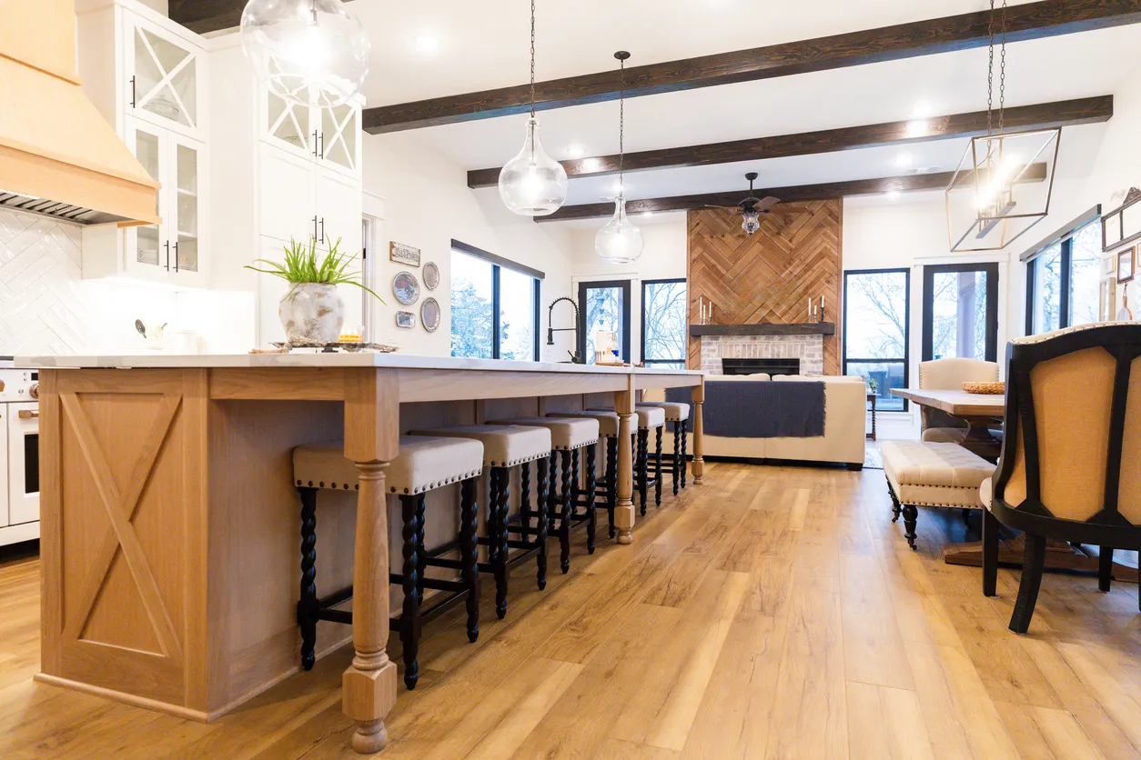 Open-concept kitchen renovation with large island, custom wood cabinetry, and layout designed for cooking and entertaining in Ontario