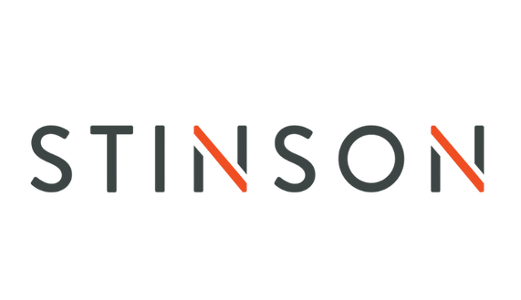 Logo text 'STINSON' with diagonal orange slashes crossing the letters 'I' and 'N'.