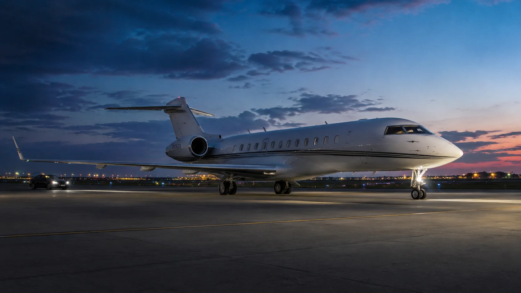 A private charter jet on the tarmac at sunset