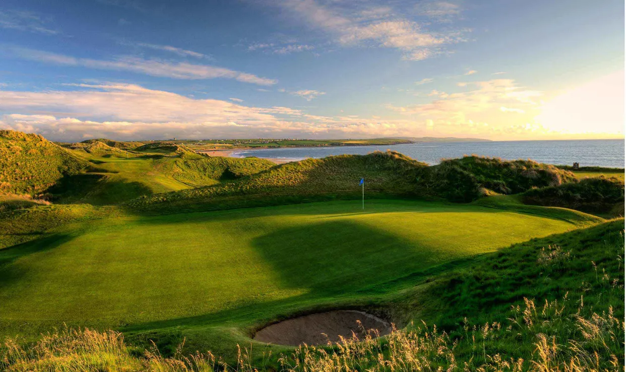 A links golf course on the Irish coast at sunset