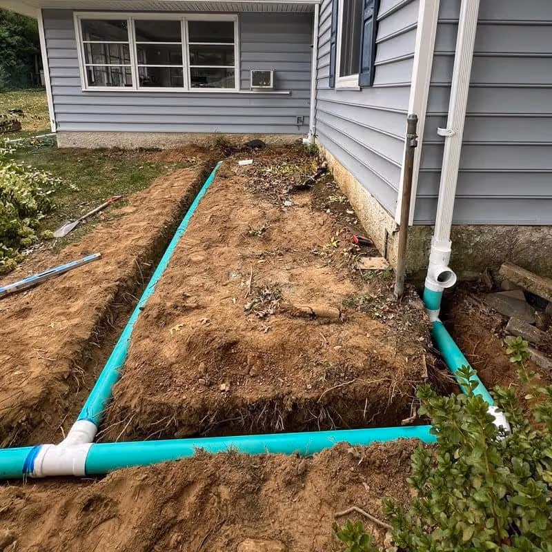 Installing underground downspouts to protect homes near Swarthmore, PA