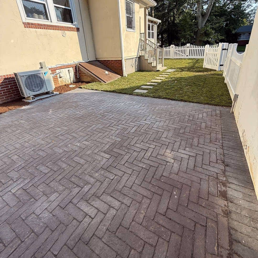 Brick walkway around house for vibrant landscaping in Rose Valley, PA