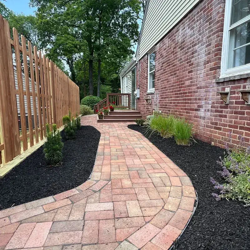 Mulch install brick walkway around house for mulch installation around garden beds for vibrant landscaping in Rose Valley, PA