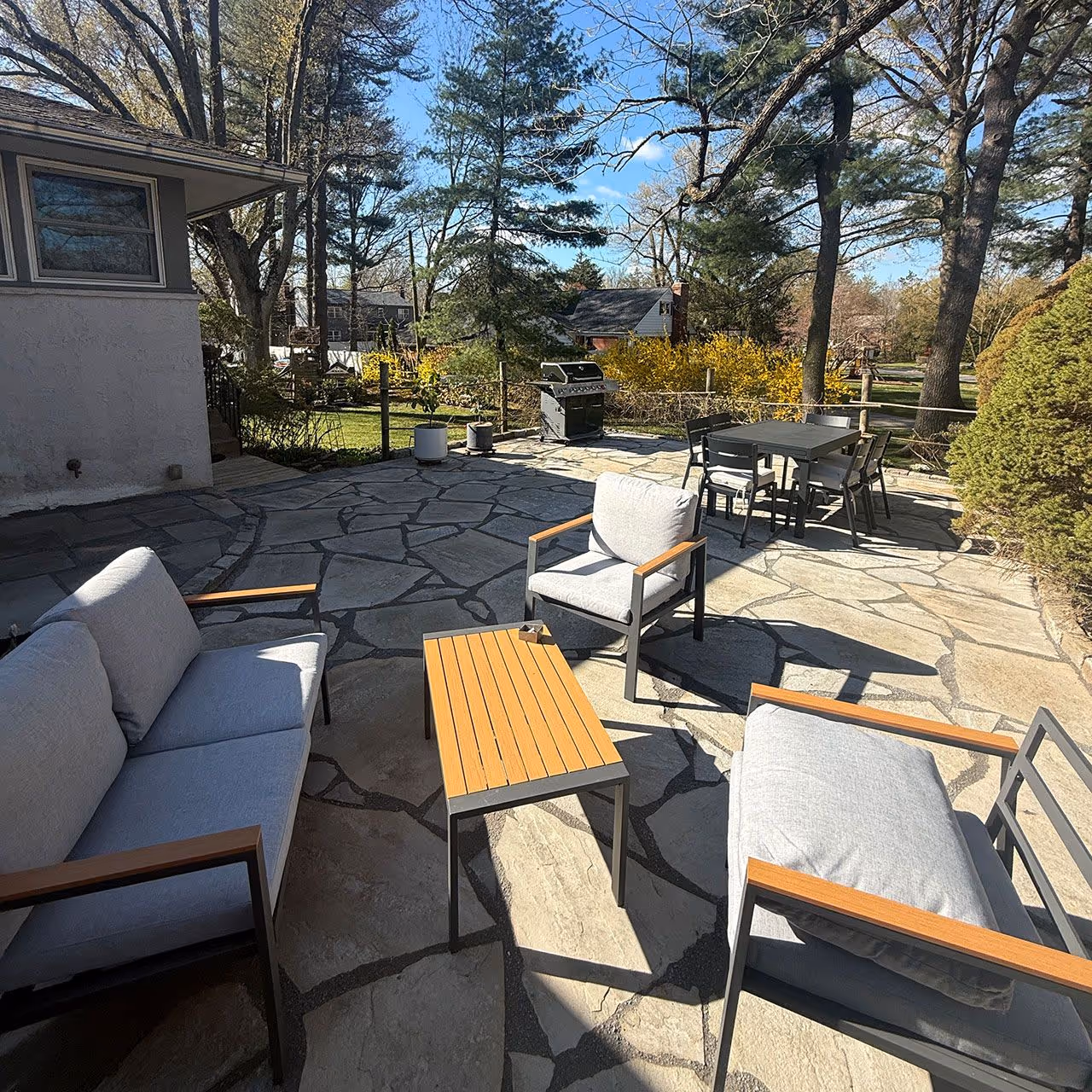 Custom hardscape installation featuring paver patio and outdoor living space near me