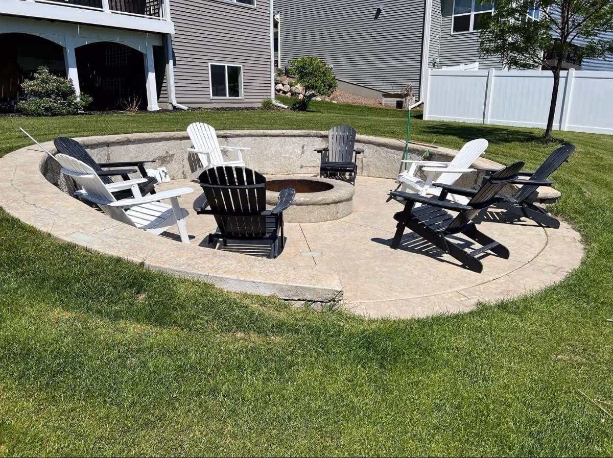 Concrete patio with fire pit in center