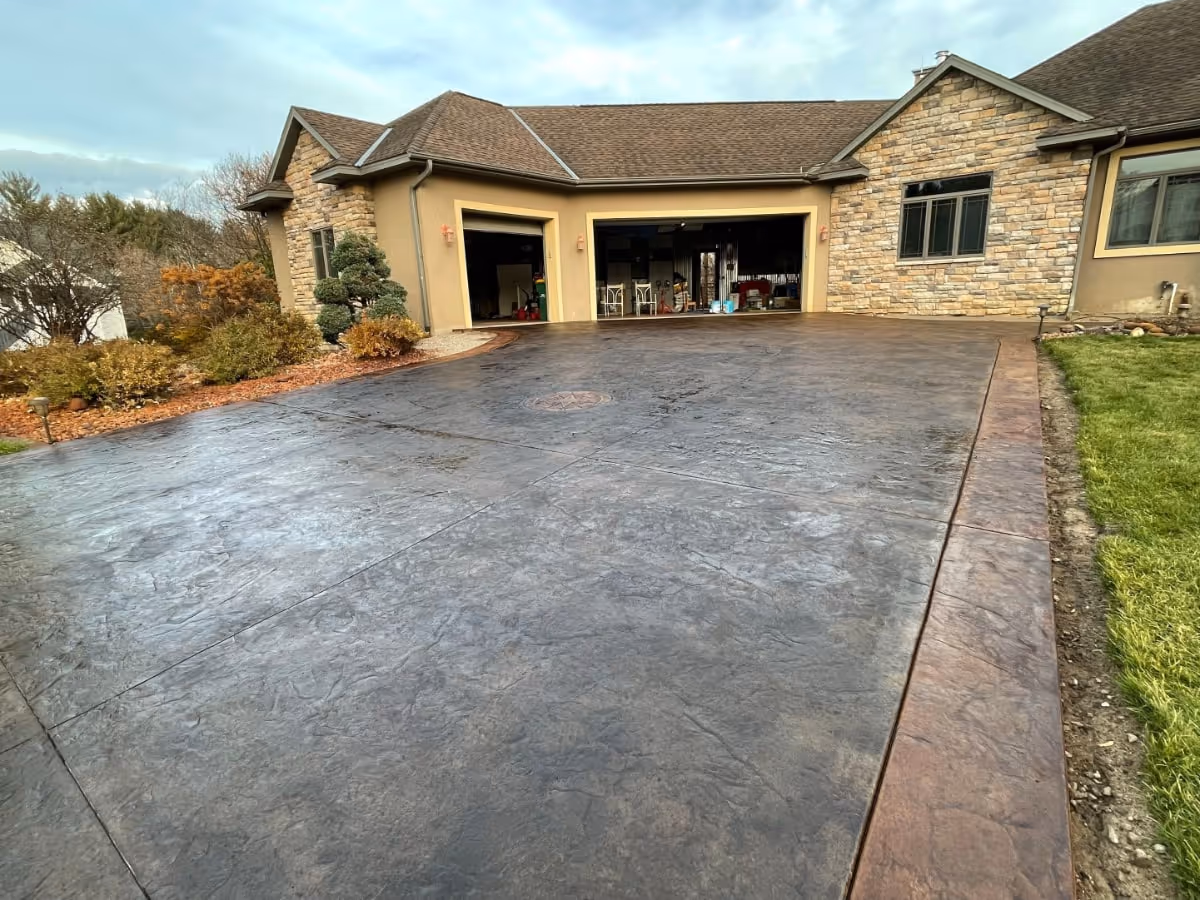 full view of stamped and stained concrete driveway